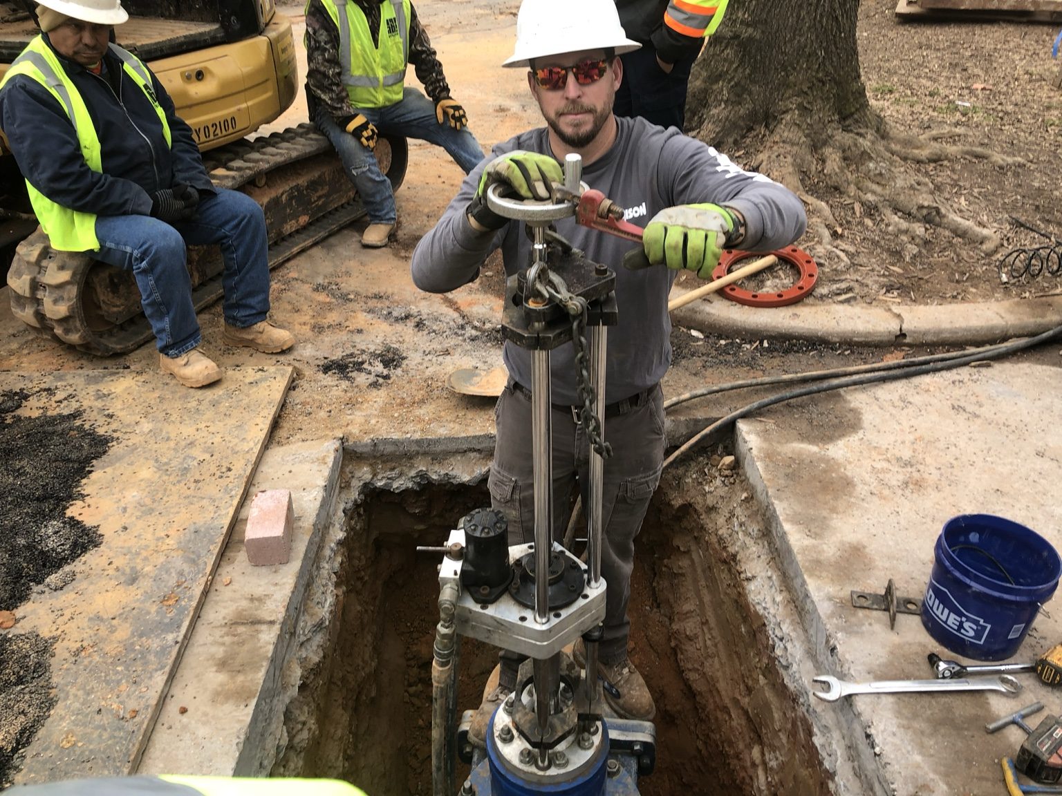 John working on valve insert equipment
