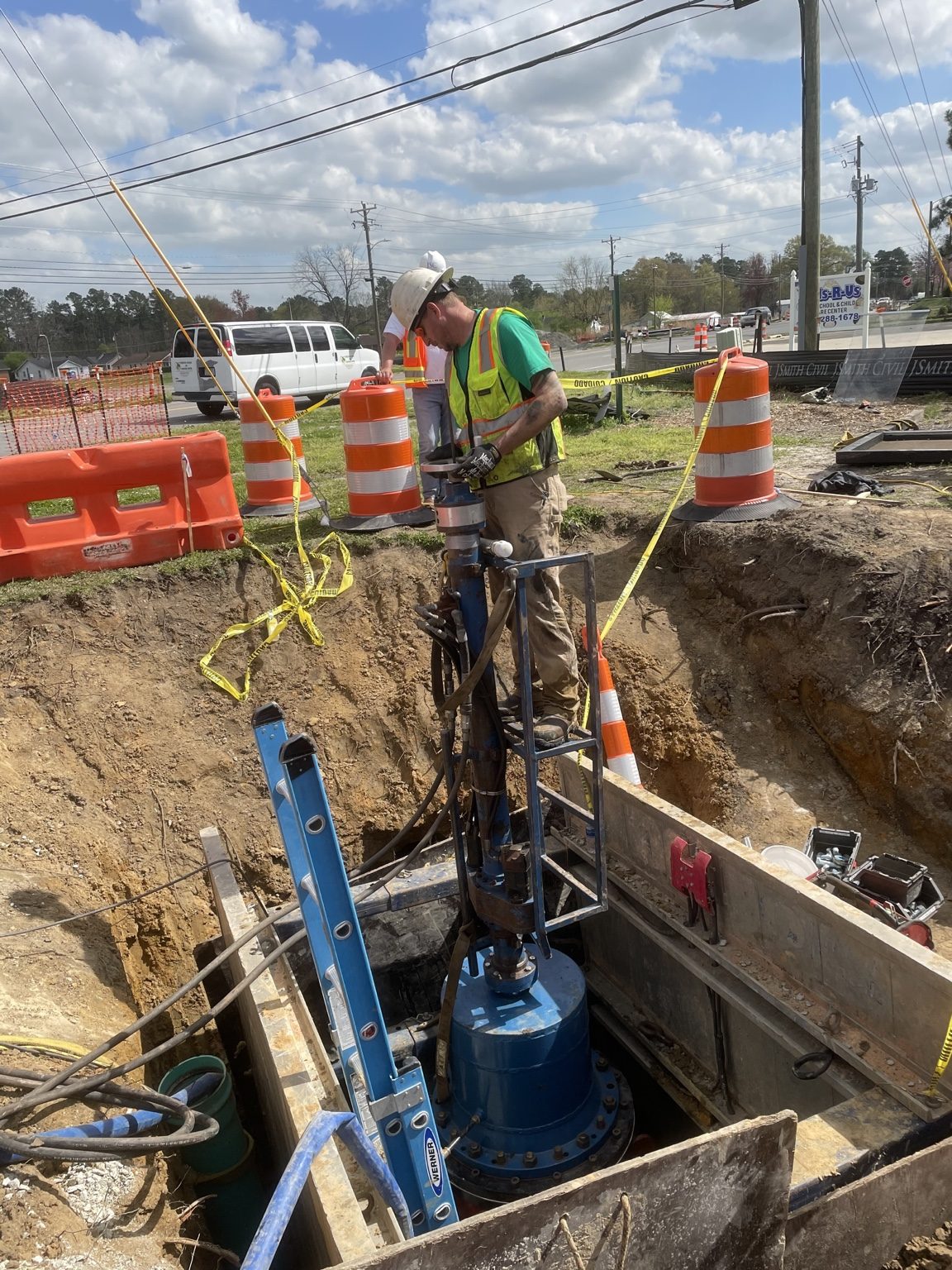 John installing a valve insert on a live water main